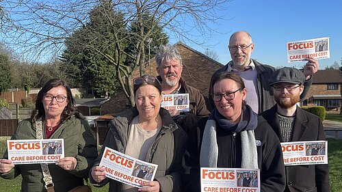 Lib Dem FOCUS Team members with leaflets about Care Link