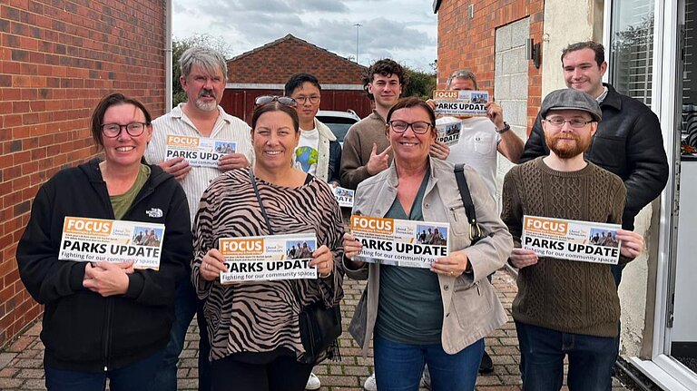 Wakefield Lib Dem members holding leaflets